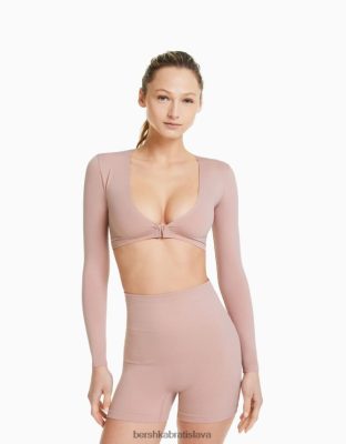 Bershka ženy Bezšvové skrátené tričko s dlhým rukávom a výstrihom do V ružová oblečenie B86RXX371 Bershka Rifle