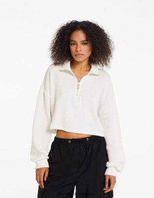 Bershka ženy pletený sveter s vysokým výstrihom a zipsom krém oblečenie B86RXX1045 Bershka Slovakia