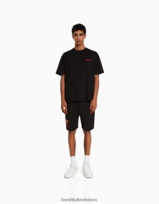 Bershka muži bermudy s potlačou keitha Haringa čierna oblečenie B86RXX3365 Bershka Rifle